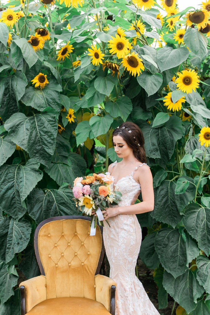 Sunflowers and Sunshine Wedding Inspo bride and gold chair