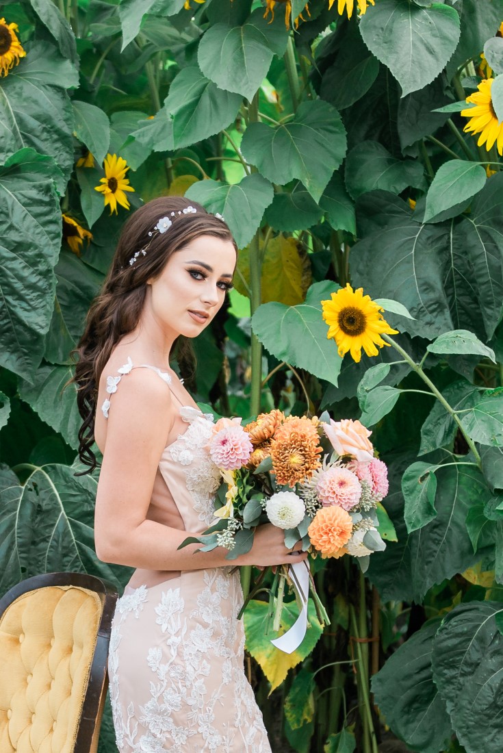 Sunflowers and Sunshine Wedding Inspo bride and her bouquet