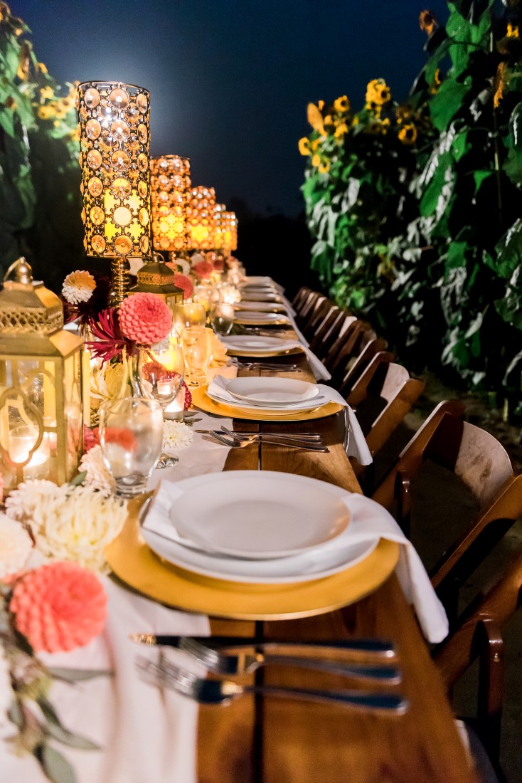 Sunflowers and Sunshine Wedding Inspo yellow chargers and funky lamps tablescape