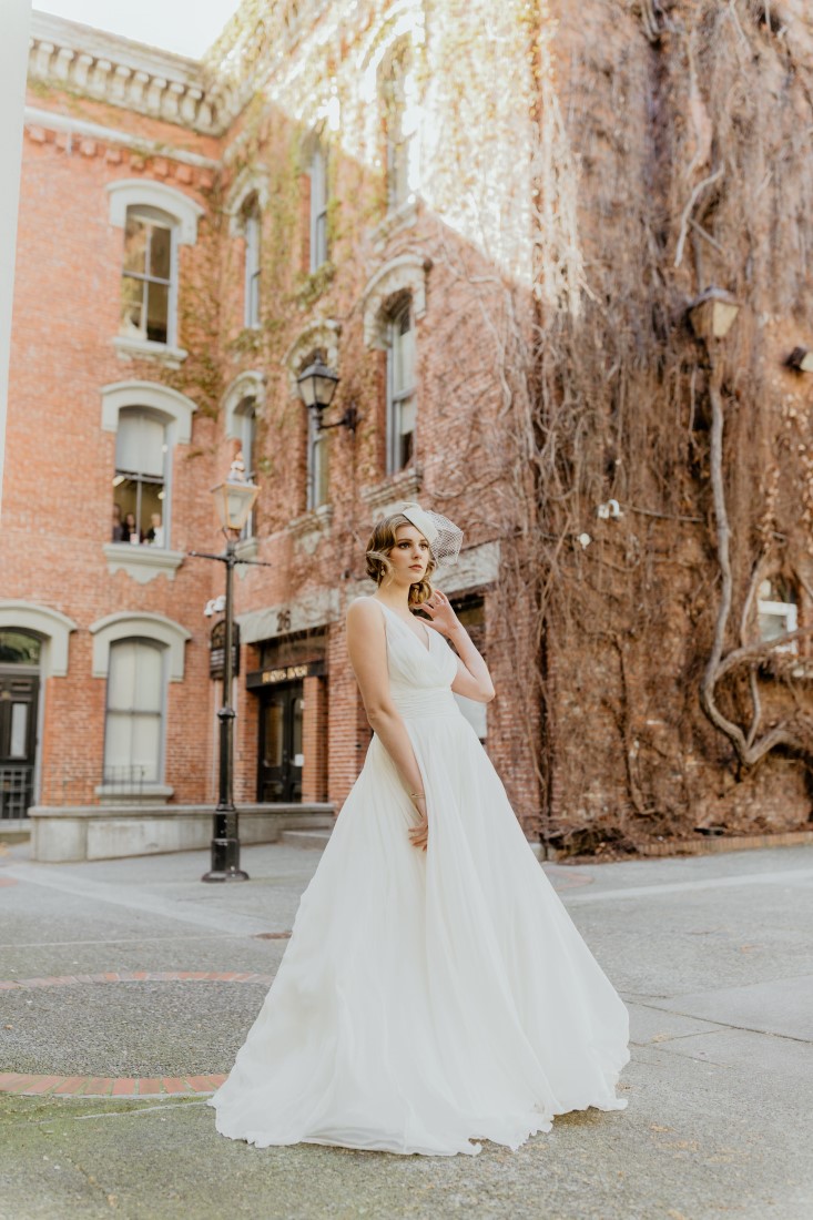 Coffee Love in Comox Valley Luke Liable Photography bride strikes a pose in gorgeous flowing gown