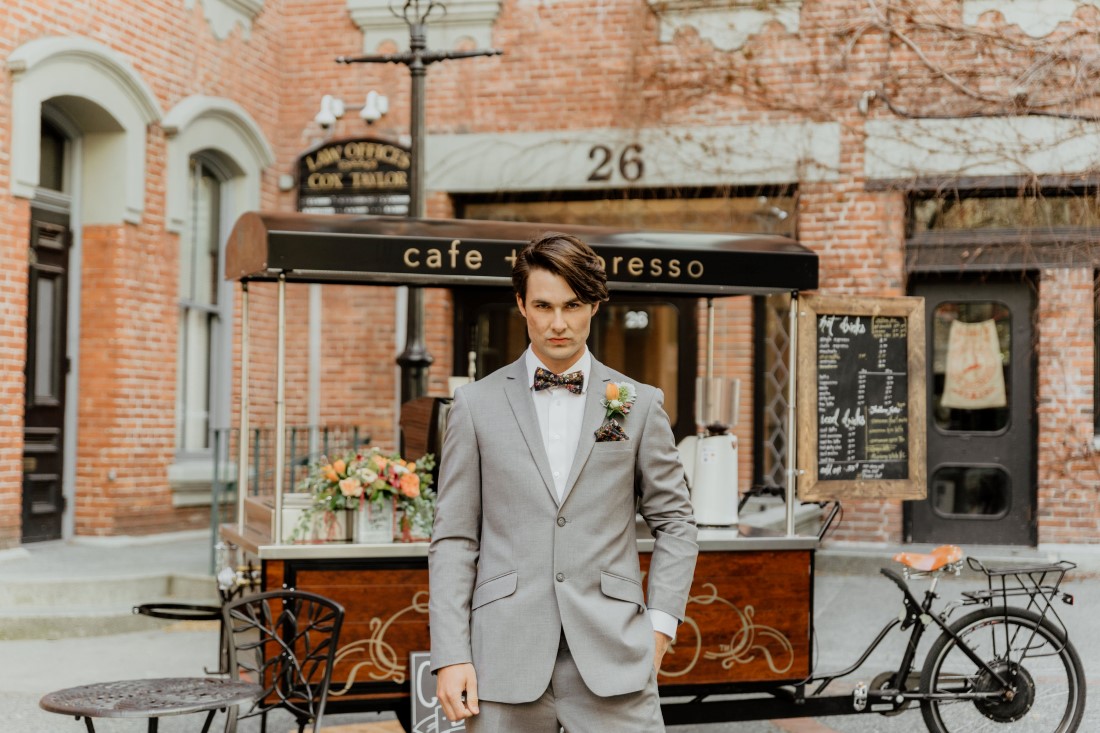 Coffee Love in Comox Valley Luke Liable Photography groom in grey suit, boutonniere and floral bowtie