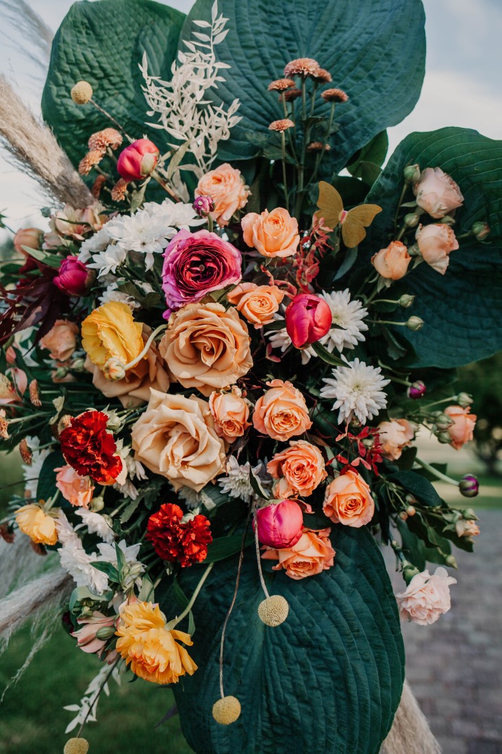 Cascade of roses on wedding reception table by Brown's the Florist Vancouver Island