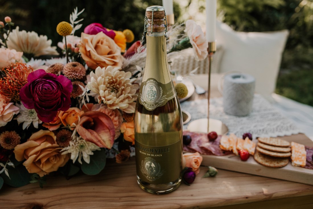 A Styled Elopement picnic and sweetheart table covered with antique roses