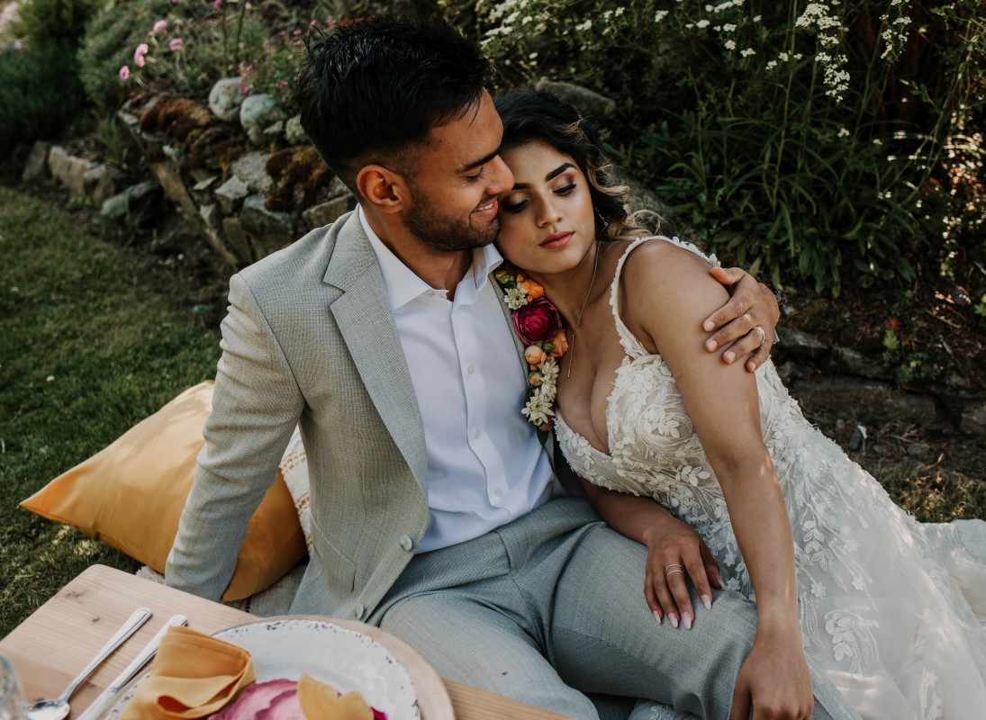 Newlyweds relax at elopement picnic at HCP Gardens Vancouver Island