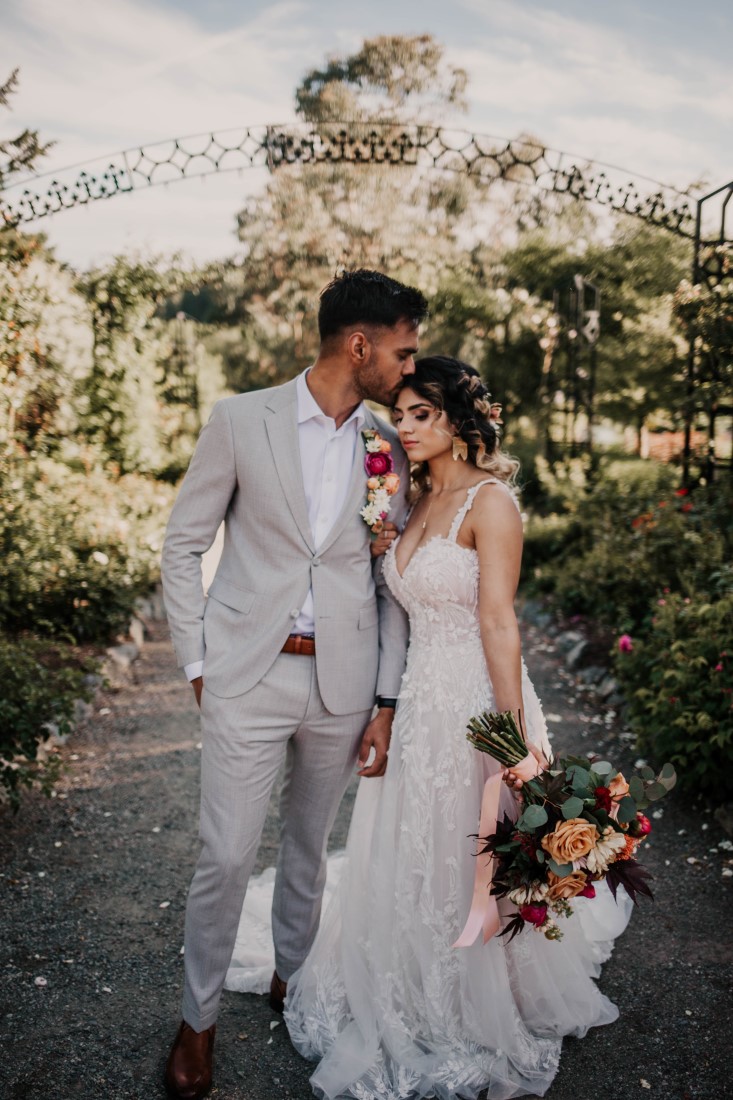 A Styled Elopement at HCP Gardens newlyweds walk down path