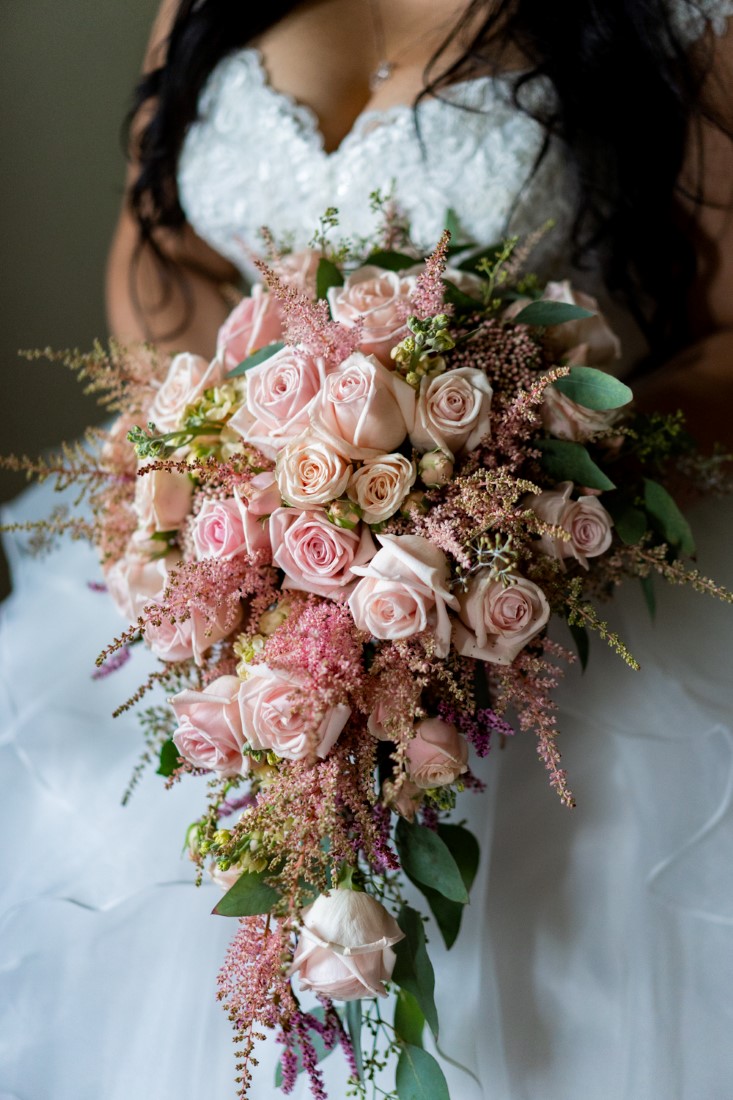 Stunning cascading bridal bouquet of pink roses by Niki Trading Vancouver