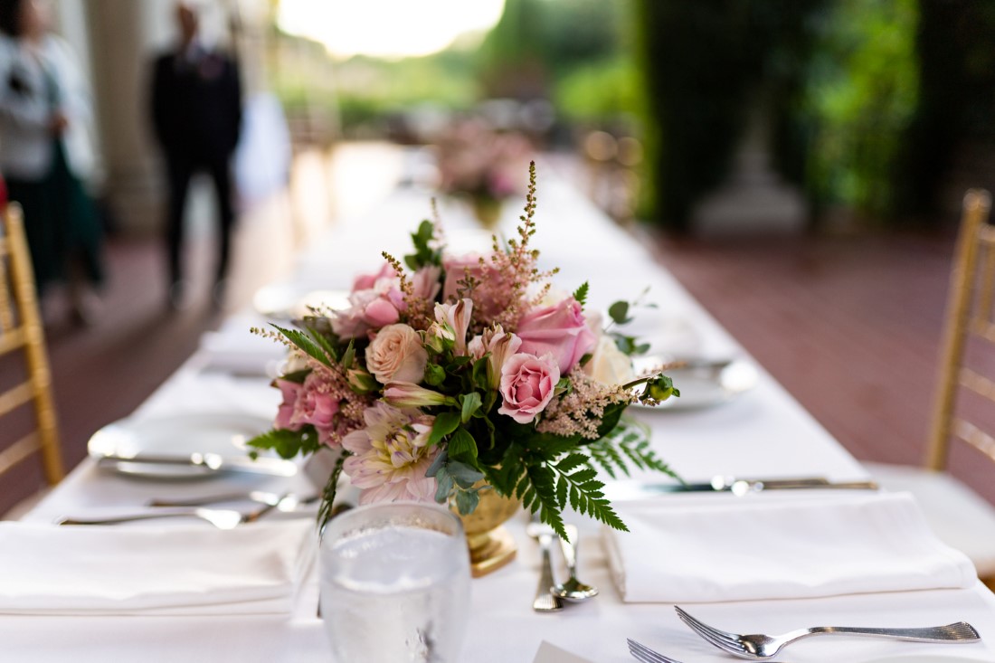 Blush and pink roses on wedding reception table by Niki Trading Vancouver