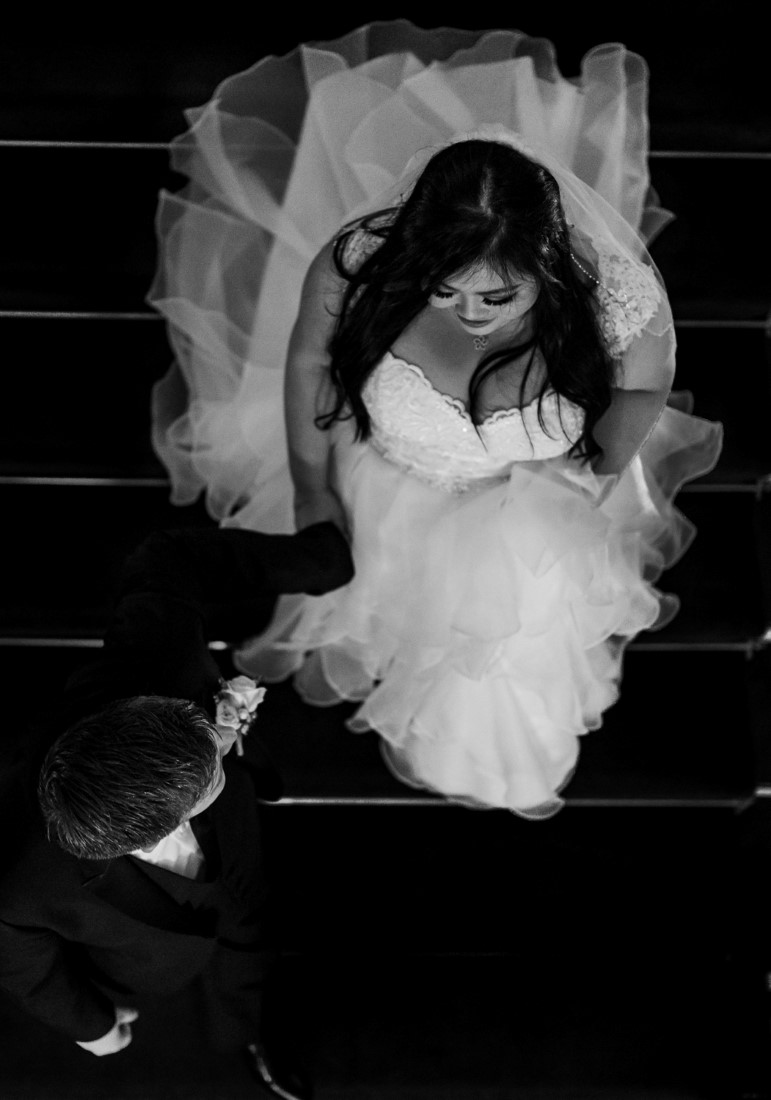 Bride comes up the stairs in black and white by Justin Kho Photography Vancouver