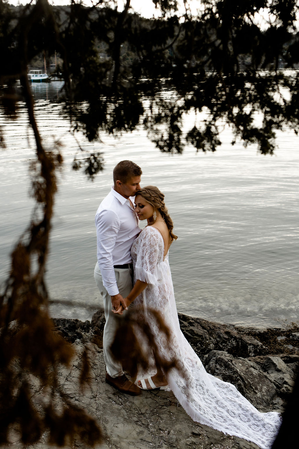 Adventure Elopement Couple pose in front of the ocean on Vancouver Island